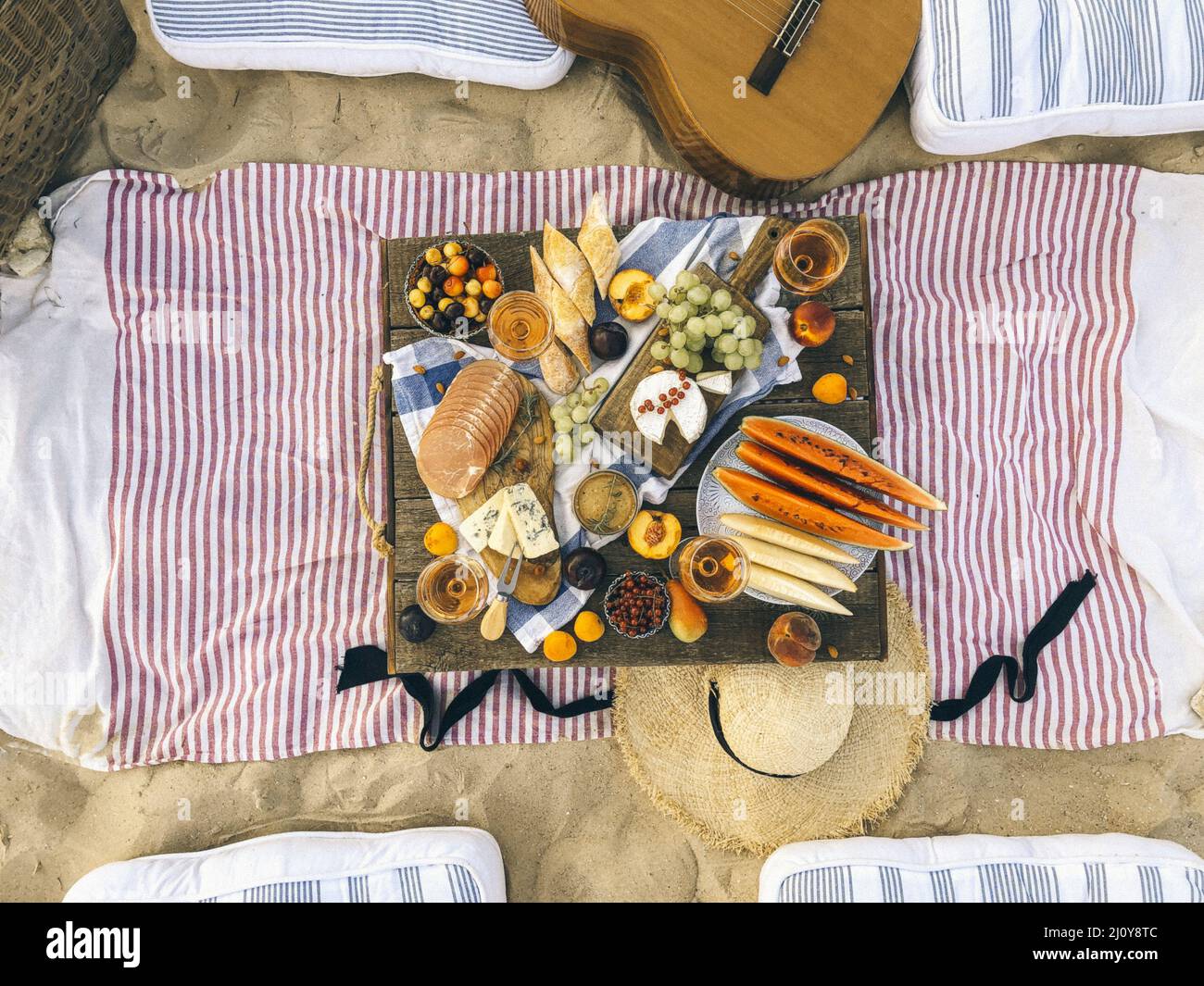 Delicious food on table on beach Stock Photo