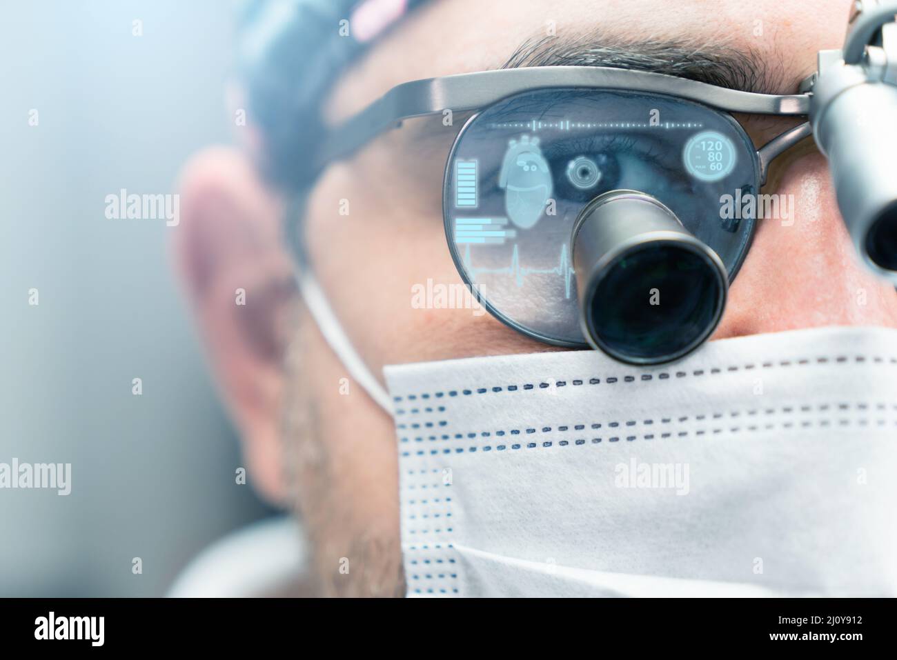 Surgeon in augmented reality glasses with a head up display.  Stock Photo