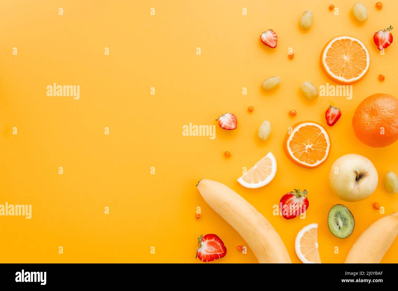 Assorted fruit yellow background. High quality photo Stock Photo