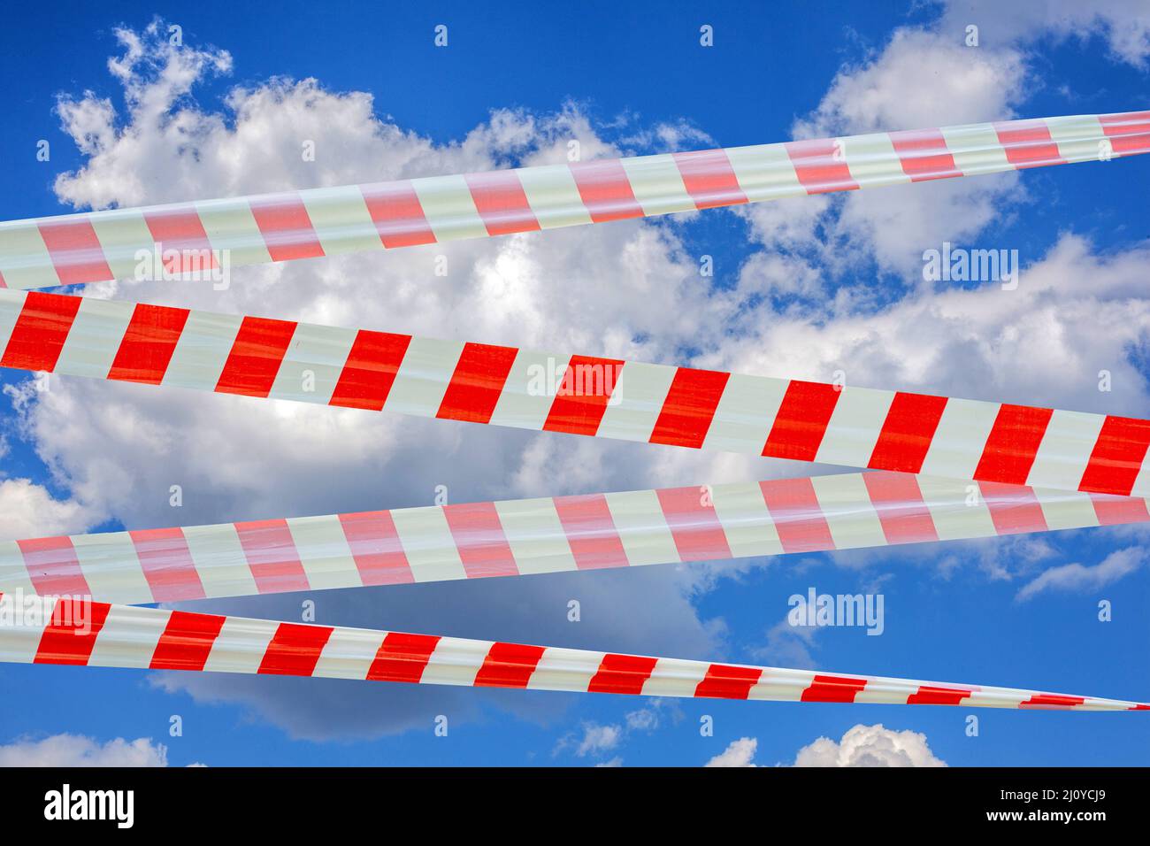 Sky is covered with barrier tape. Ban on flights due to quarantine. Stock Photo