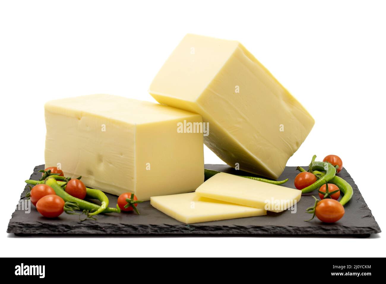 Cheddar cheese or kashkaval cheese isolated on white background. Cheese slices on the serving board Stock Photo