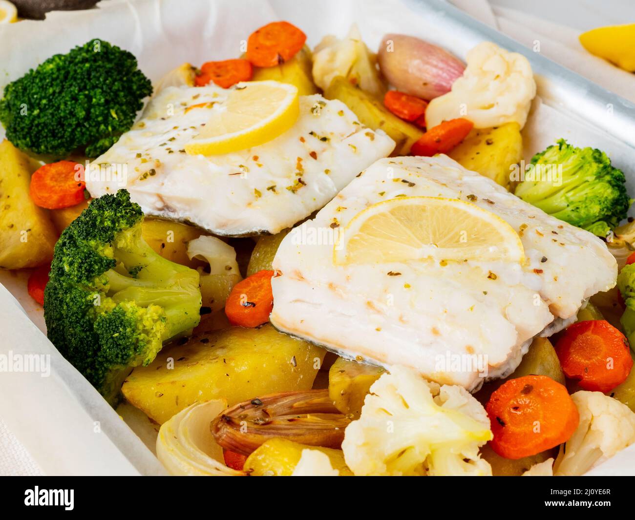 Fish cod baked with vegetables - healthy diet healthy food. Light white ...