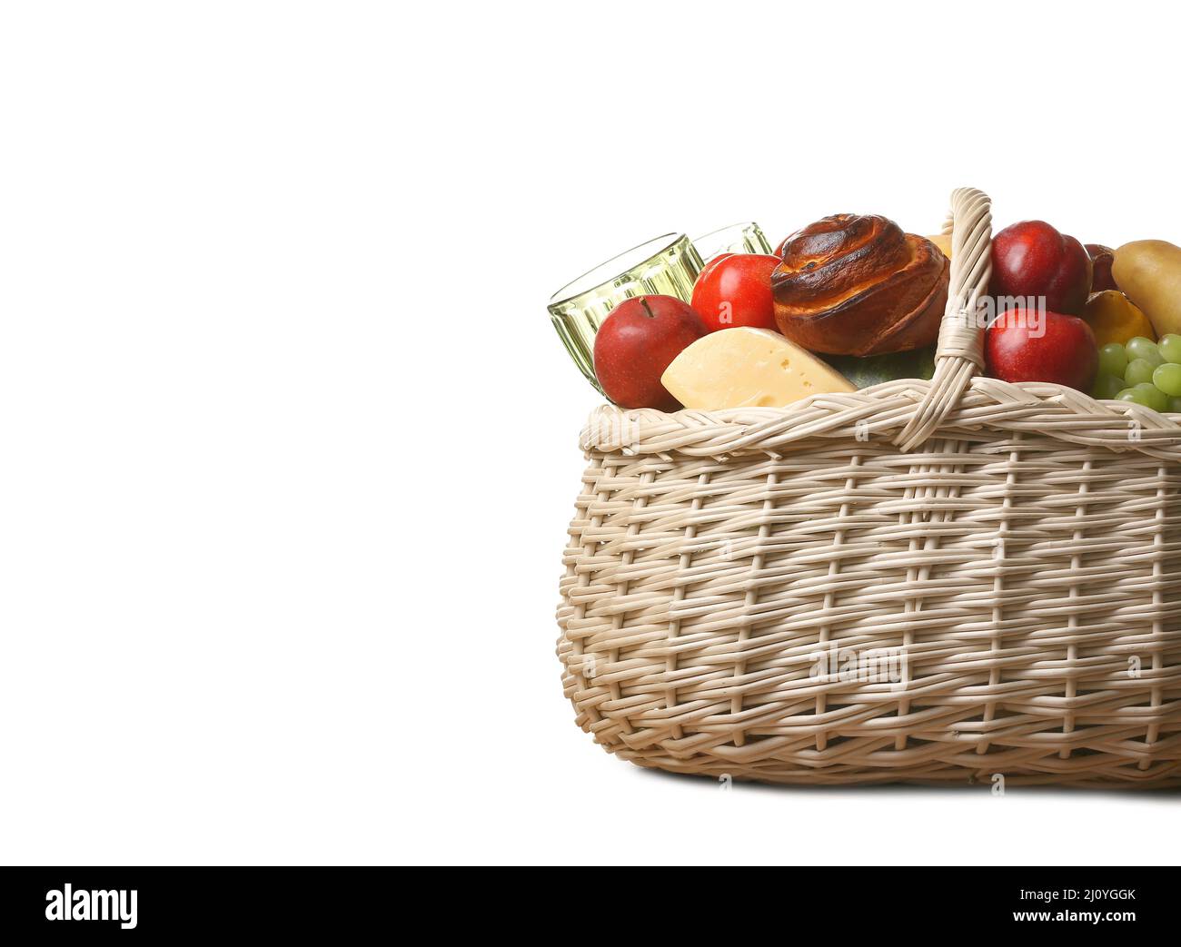 Wicker basket with tasty food for picnic on white background Stock ...