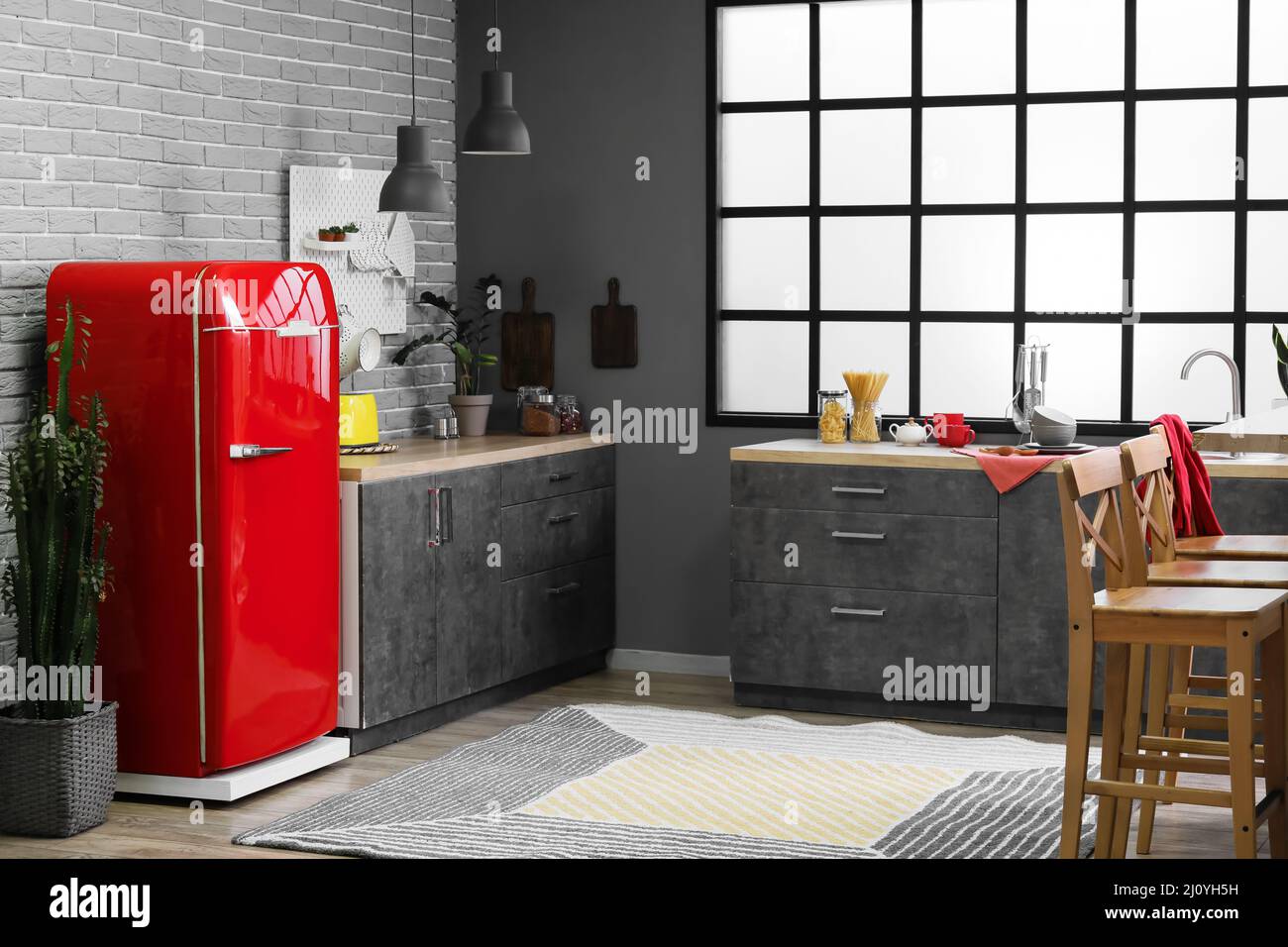 Interior of modern kitchen with stylish refrigerator and counters Stock ...