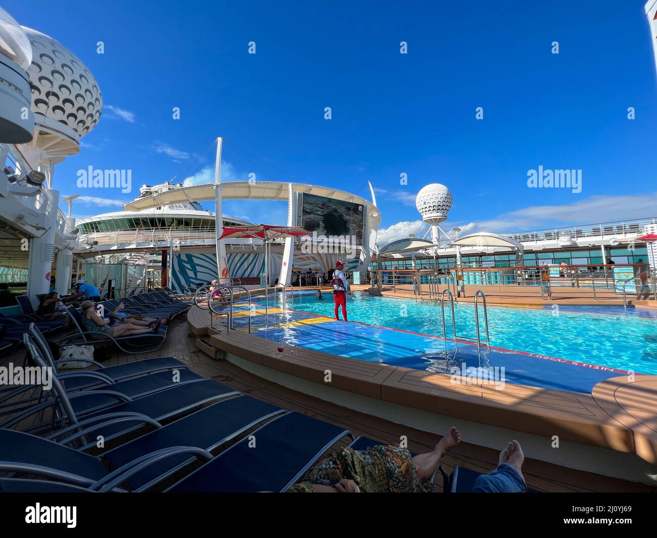 Orlando, FL USA - December 6, 2021:  The  main swimming pool area on the Royal Caribbean Cruise Ship Independence of the Seas in Port Canaveral, Flori Stock Photo