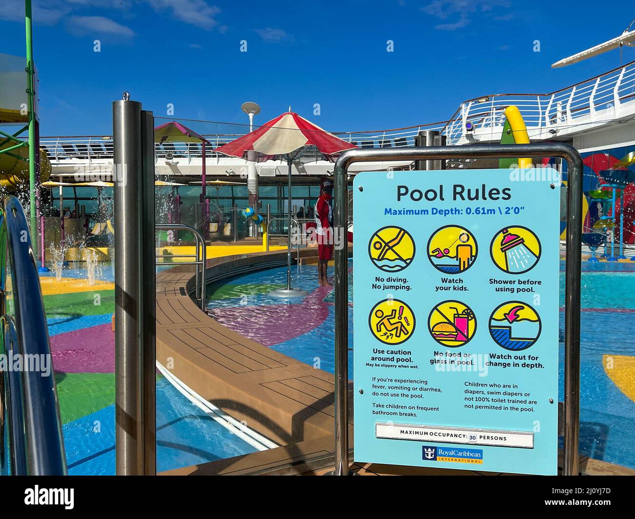 Orlando, FL USA - December 6, 2021:  The rules at the family swimming pool area on the Royal Caribbean Cruise Ship Independence of the Seas in Port Ca Stock Photo