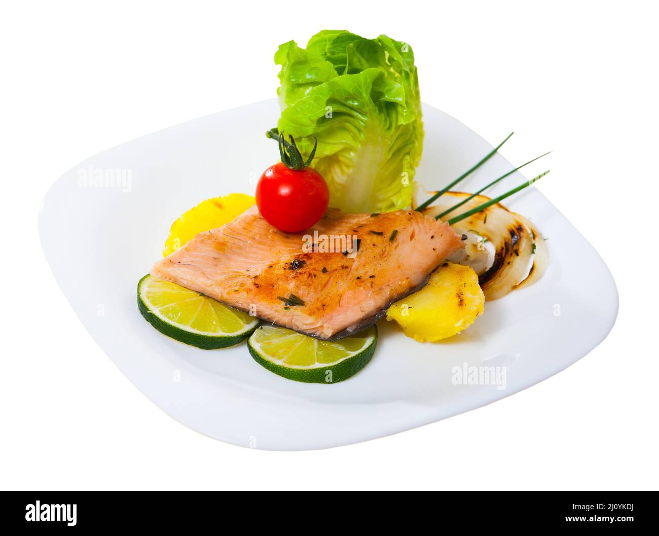 Baked trout fillet with potatoes on white plate Stock Photo