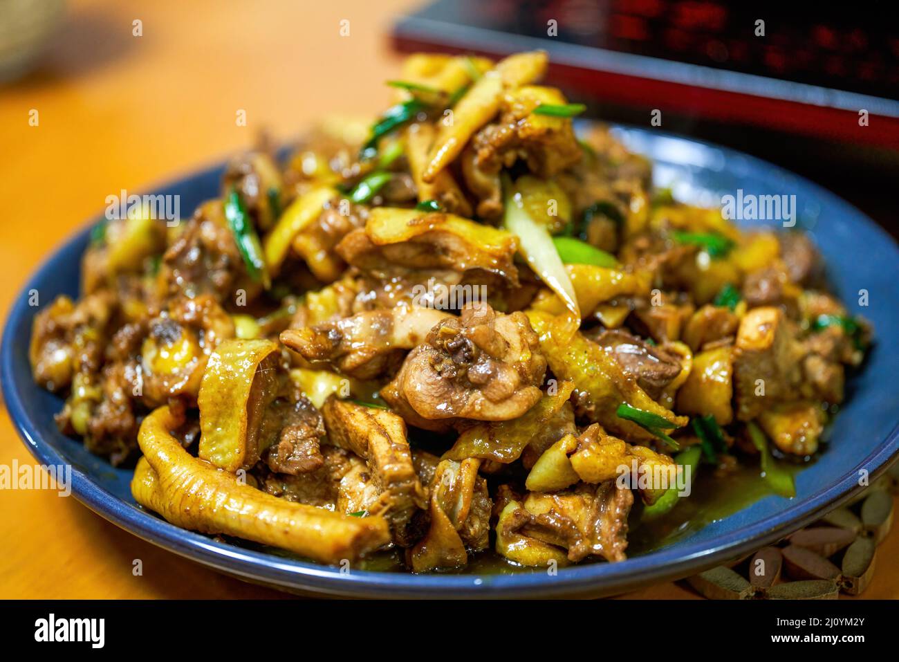 A plate of delicious Chinese home cooking, fried chicken with shallots Stock Photo