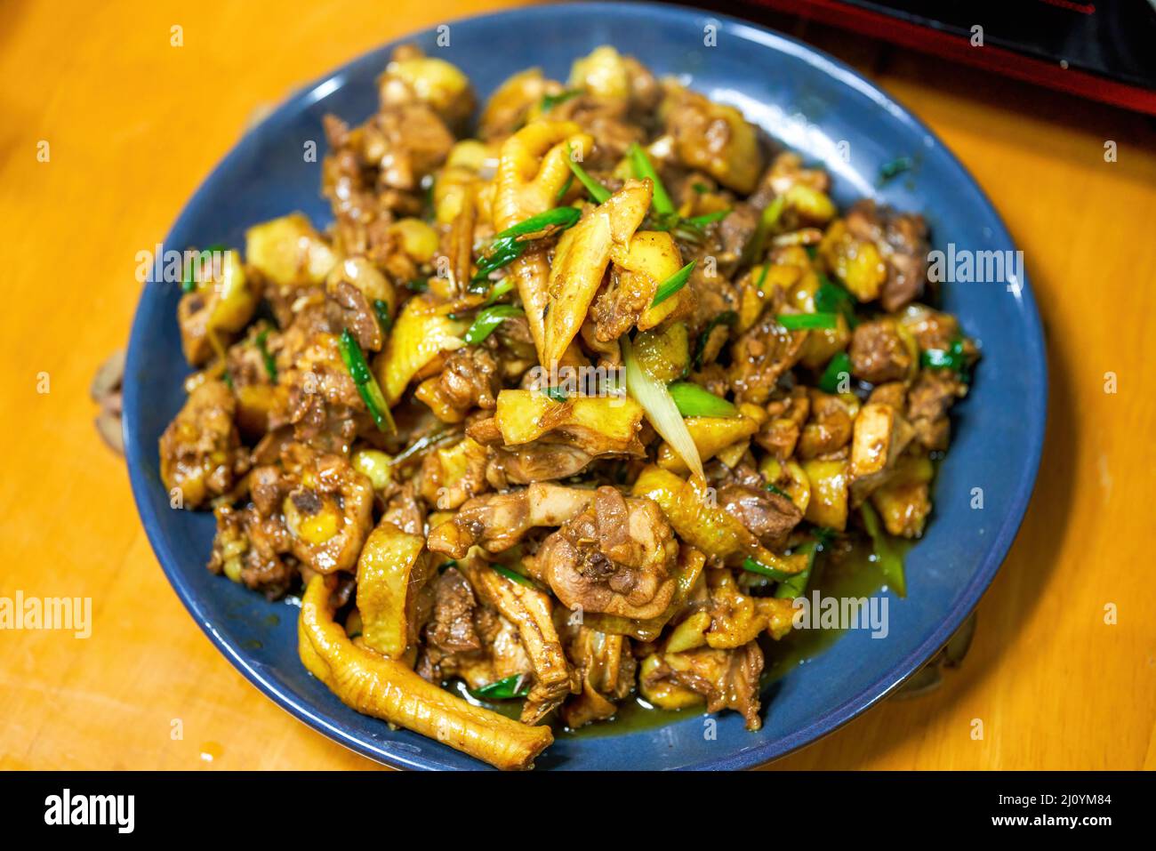 A plate of delicious Chinese home cooking, fried chicken with shallots Stock Photo