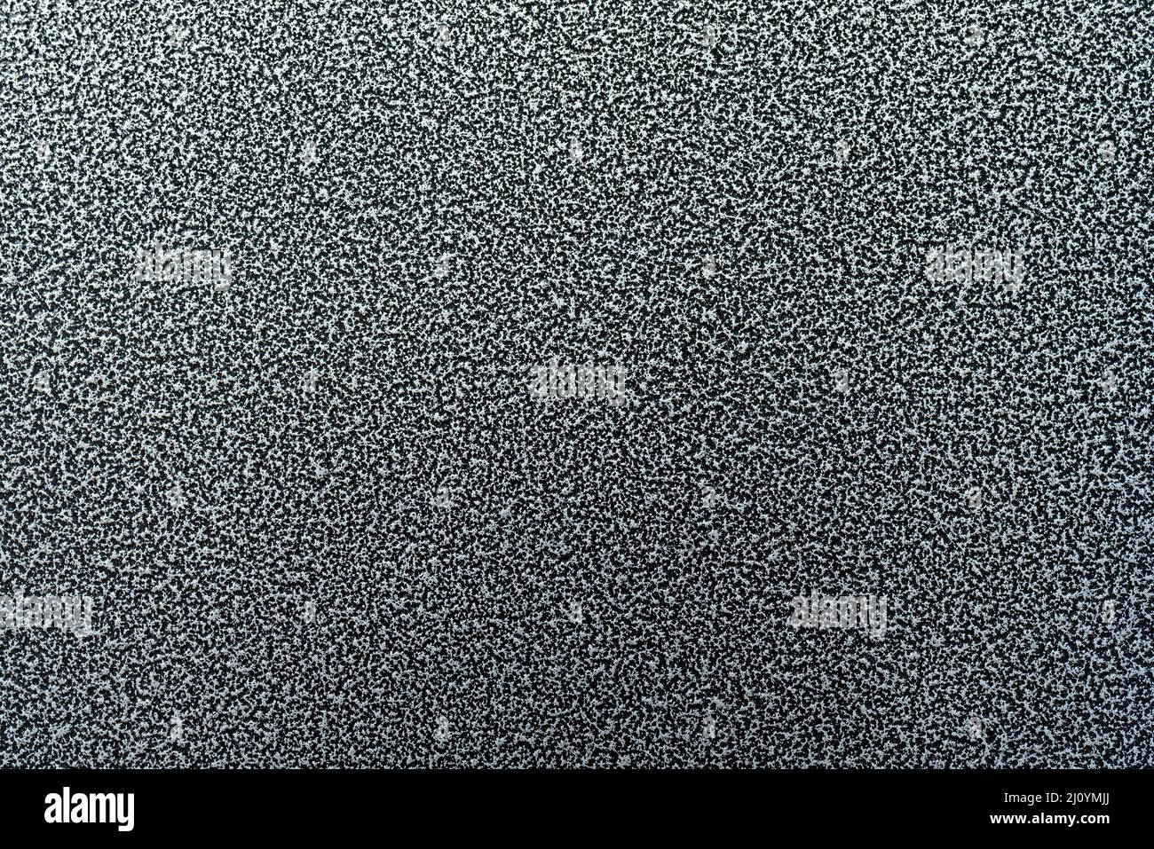 Etched dark metal texture. Abstract black background. Stock Photo