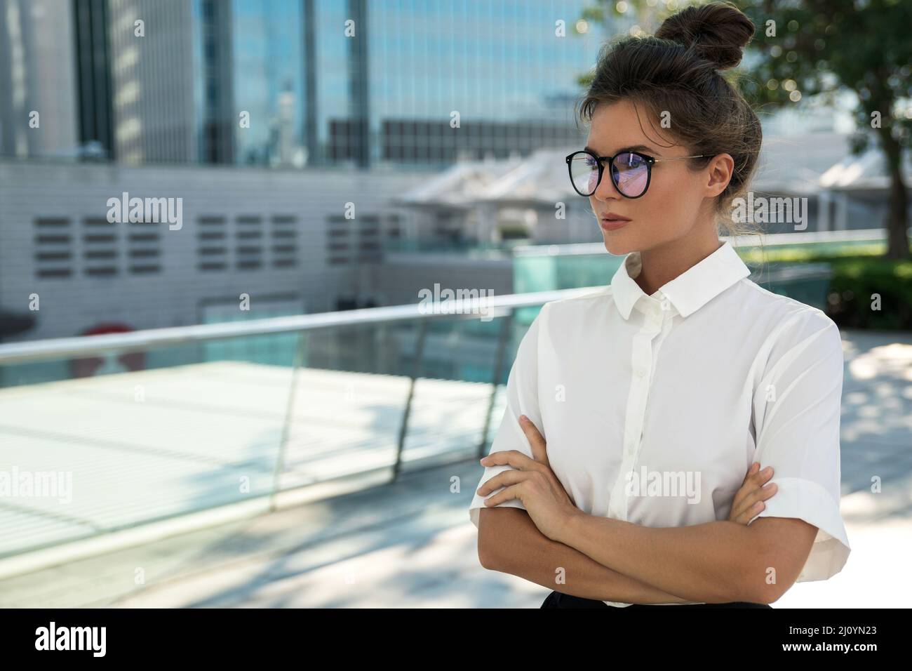 Woman wearing smart casual clothing in the modern city Stock Photo