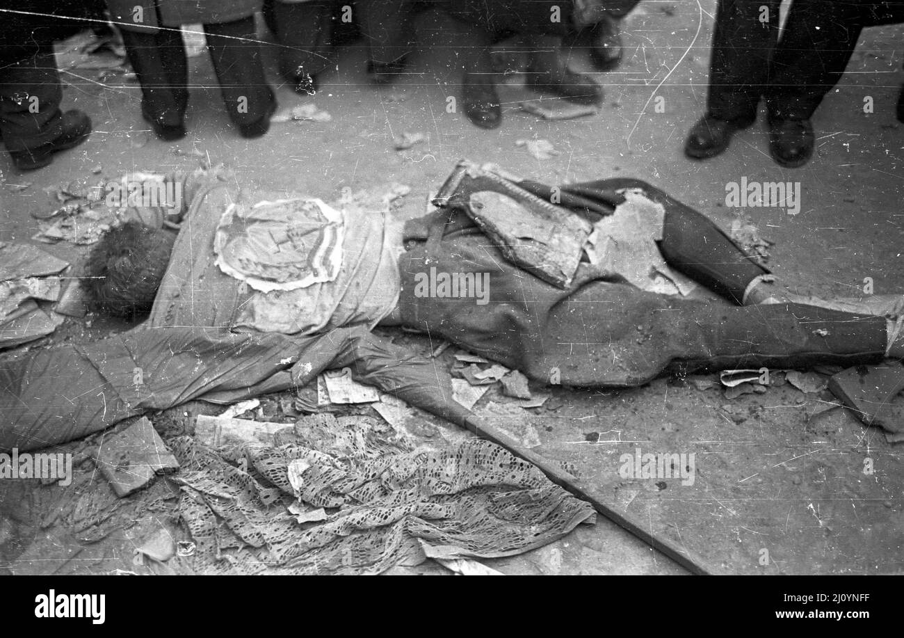 The corpse of a communist officer killed defending the headquarters of the Hungarian Communist Party, Republic Square, Budapest during the 1956 Hungarian Revolution. Stock Photo
