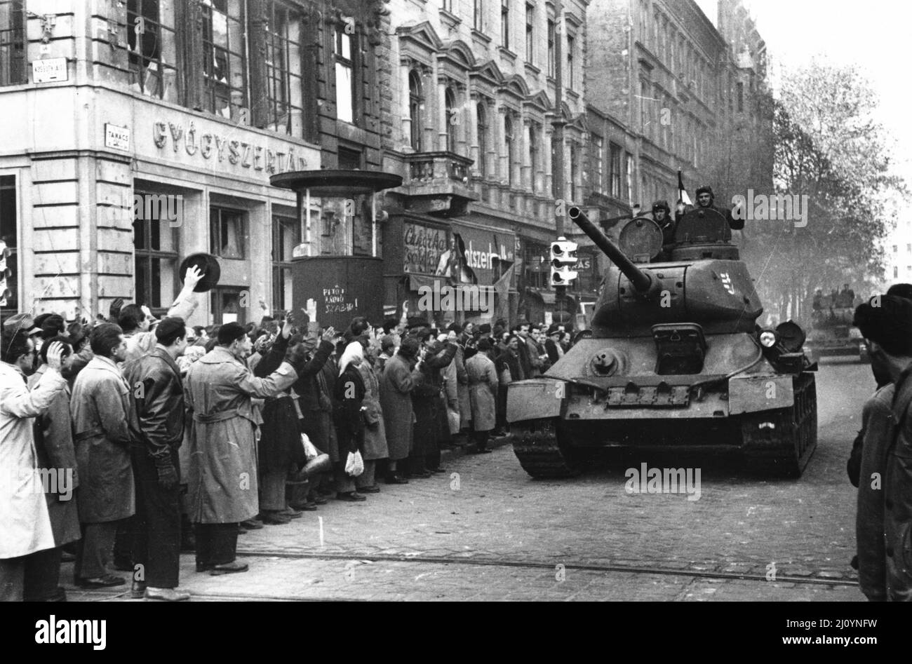 A crowd cheers nationalist Hungarian troops in Budapest during the Hungarian Revolution in 1956 Stock Photo