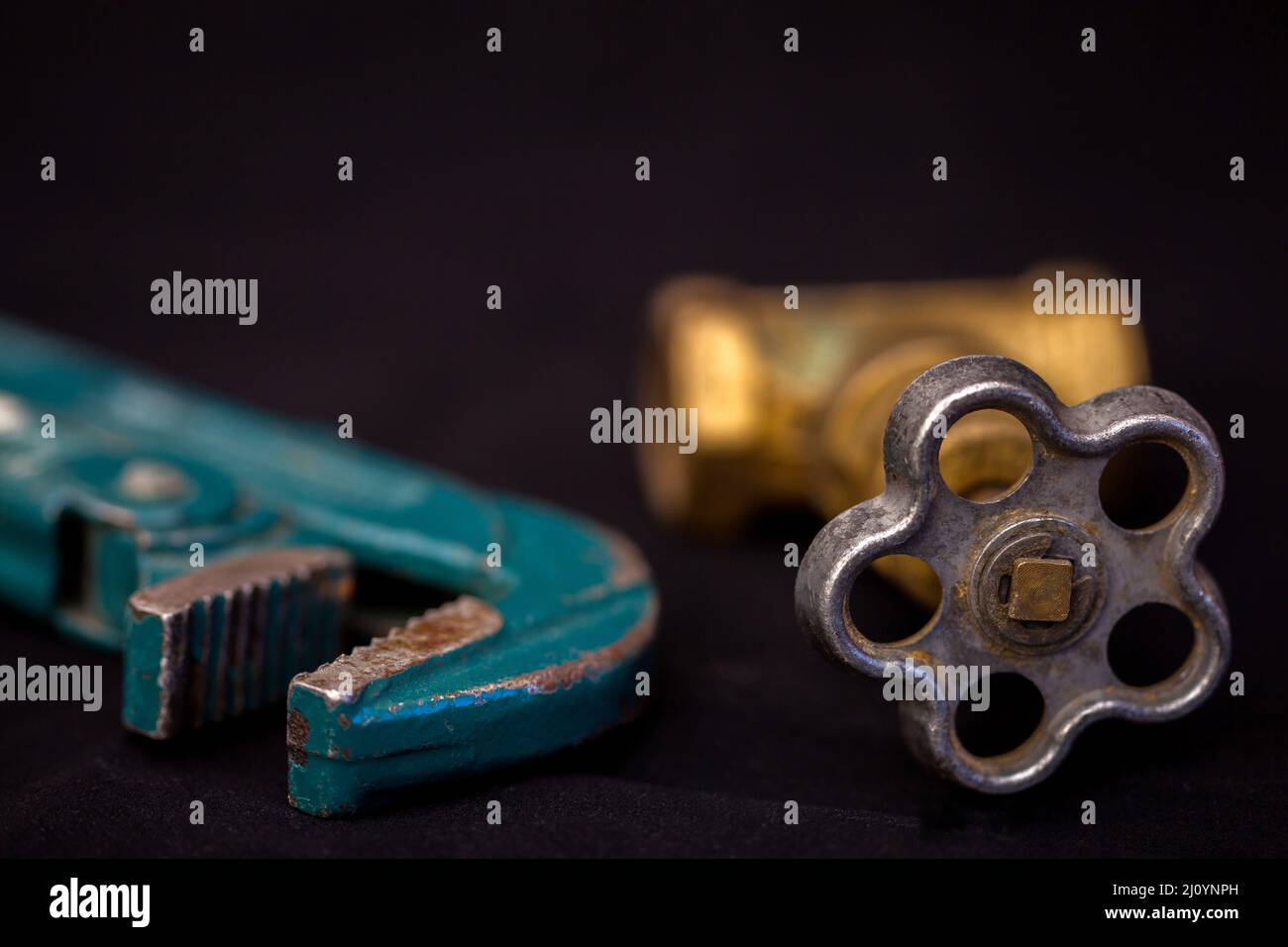 Faucets, valve, pipe wrench to repair water supply system. Plumbing