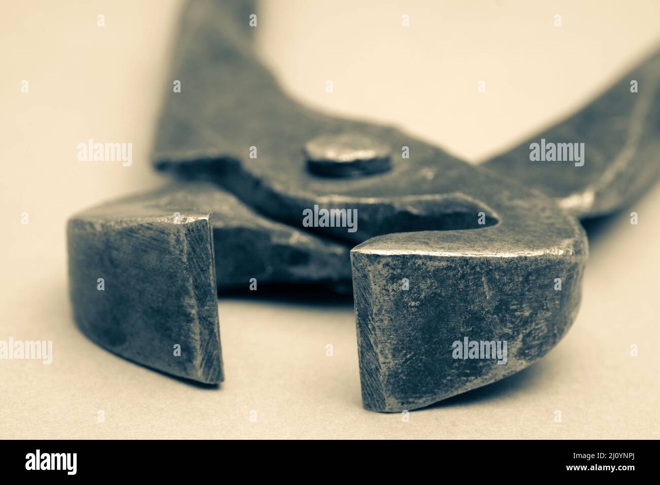 Tools for pulling nails - old metal pliers. Stock Photo