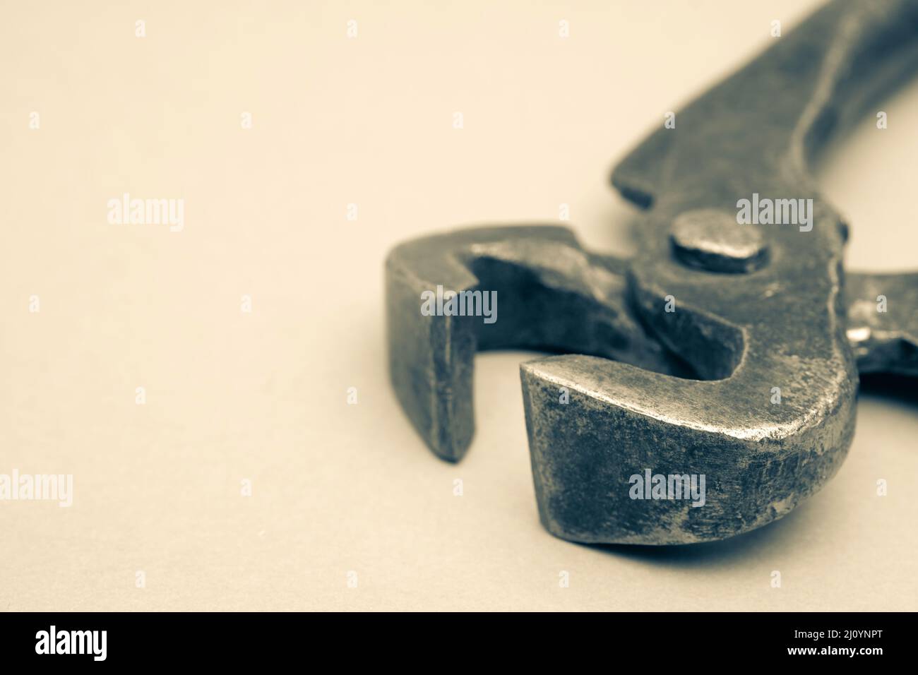 Tools for pulling nails - old metal pliers. Stock Photo