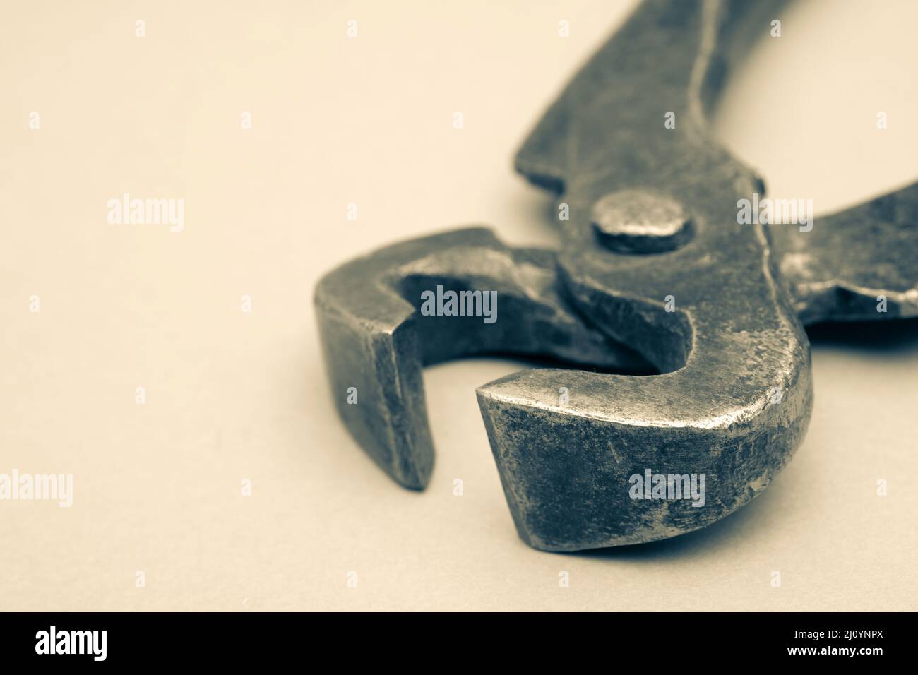 Tools for pulling nails - old metal pliers. Stock Photo