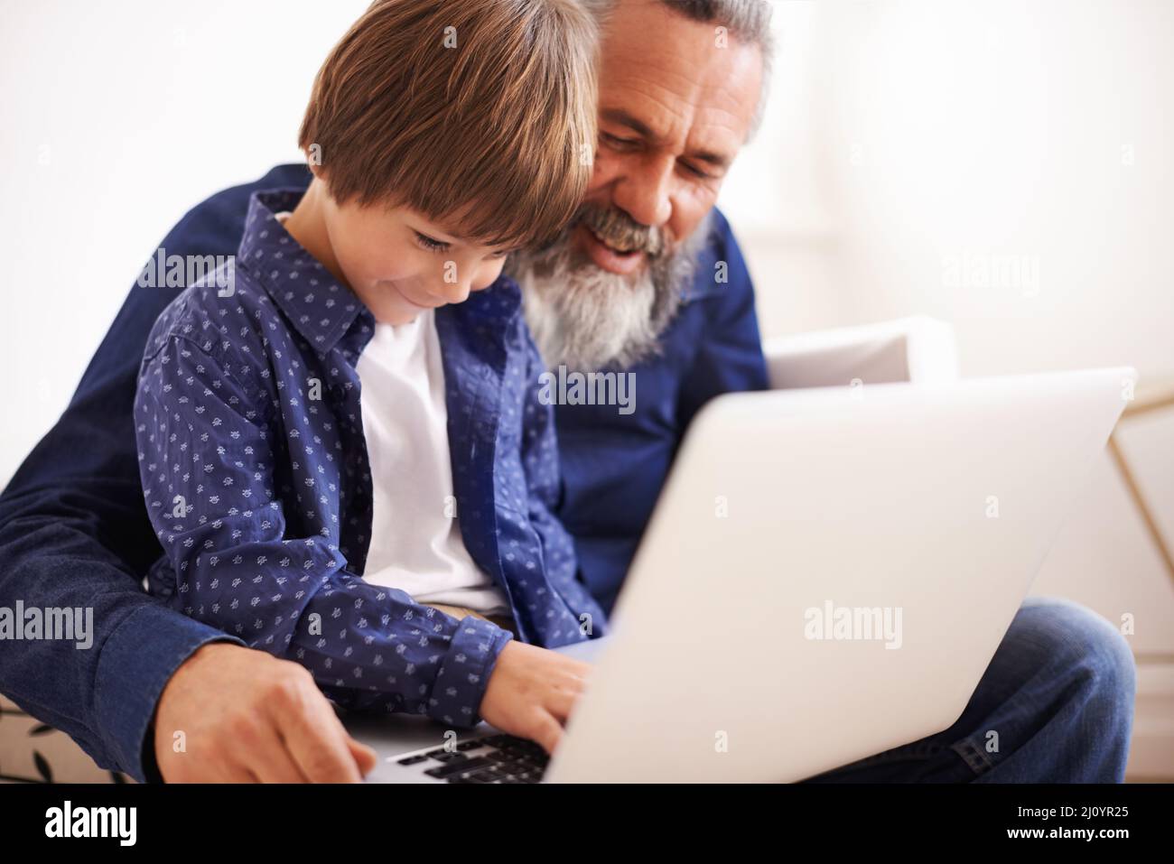 Learning with grandpa. Shot of a grandfather and grandson using a