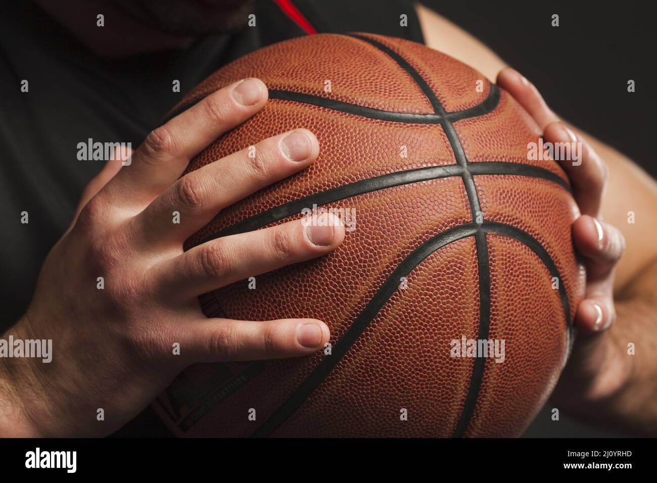 Close up hand held basketball. High quality photo Stock Photo