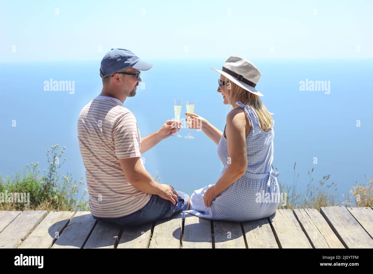 Two glasses of champagne in the hands of a man and a woman Stock Photo