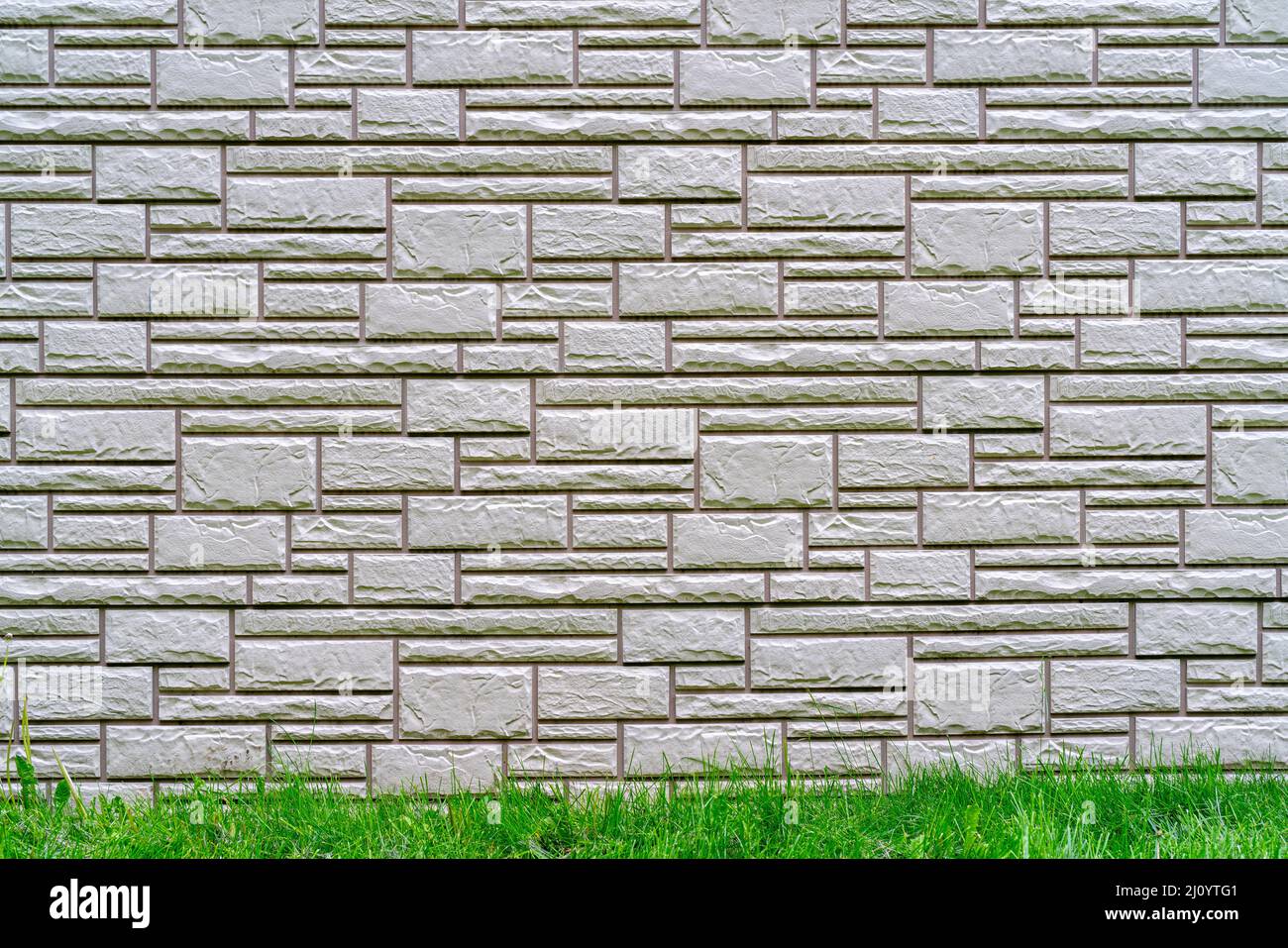 Gray brick wall. Dark abstract background. Building brick construction. Stock Photo