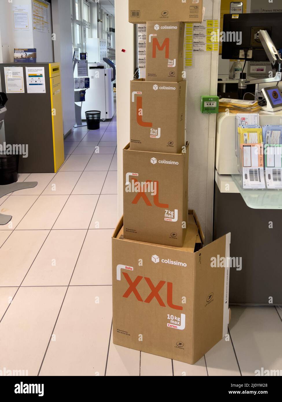Paris, France - Mar 10, 2022: Multiple packages with Colissimo postal  parcel packages with M, L, XL, XXL small, medium, extra large -service  offered by French La Poste postal operator Stock Photo - Alamy