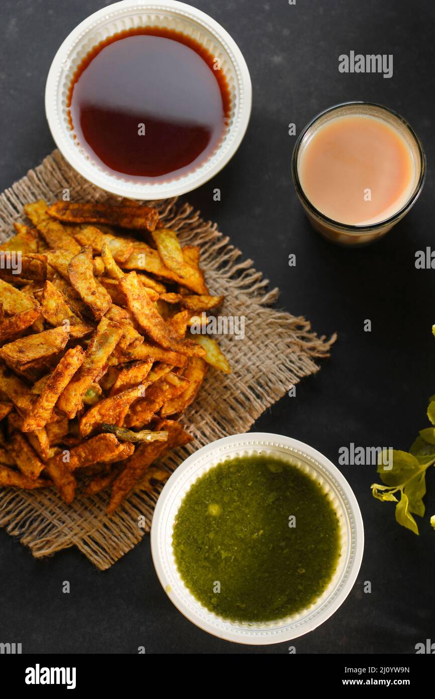 Crispy Fried Potato Chips with hot tea and sauce Stock Photo Alamy