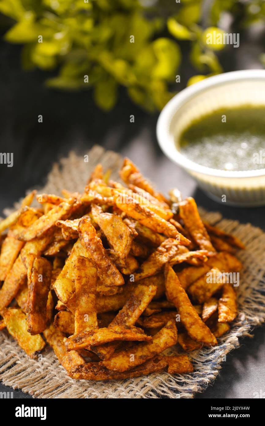 Crispy Fried Potato Chips with sauce Stock Photo Alamy