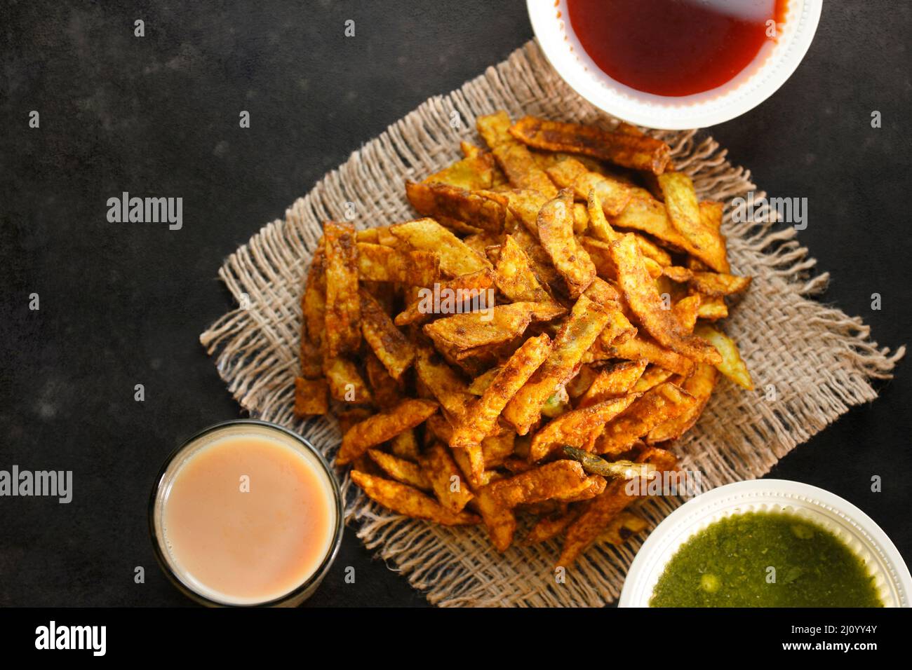 Crispy Fried Greasy Potato Chips with hot tea and sauce Stock Photo Alamy