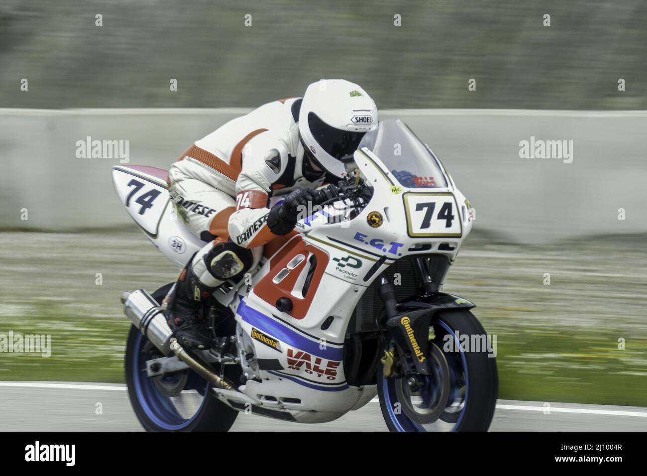 Classic racing sport motorbike running in the asphalt track Stock Photo