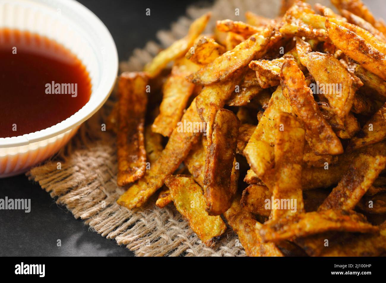 Crispy Fried Greasy Potato Chips with hot tea and sauce Stock Photo Alamy