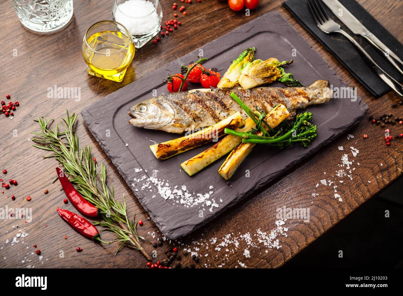 Rainbow trout grilled. Vegetables, white wine sauce. Delicious healthy