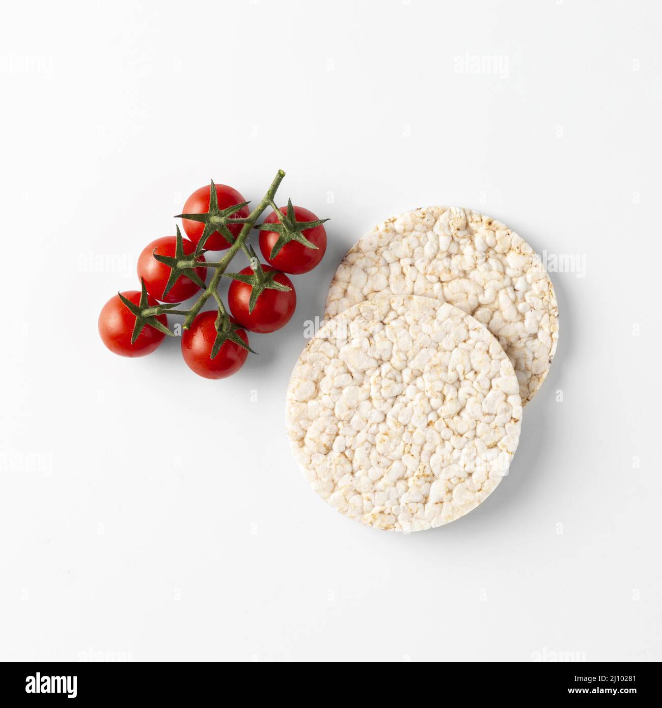 Cherry tomato fruit snack rice cakes Stock Photo Alamy