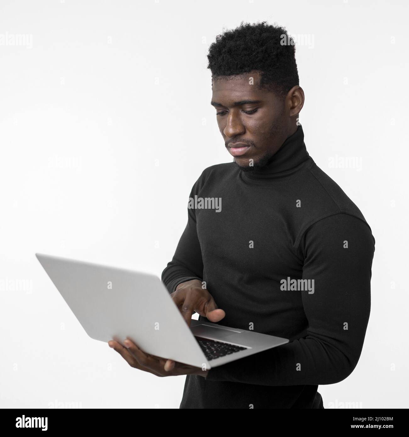 Focused man using laptop Stock Photo
