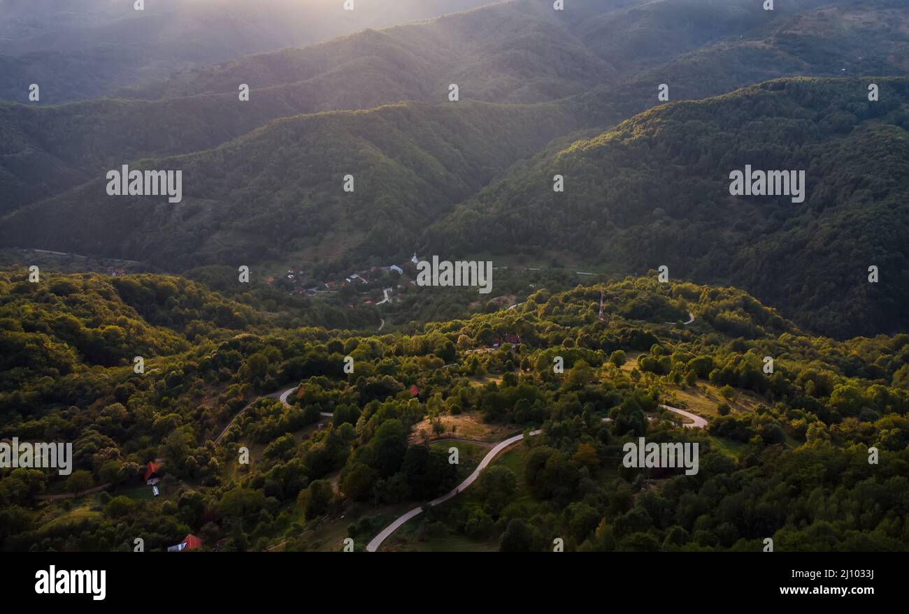Aerial view of dense forests on mountains under the sun Stock Photo - Alamy