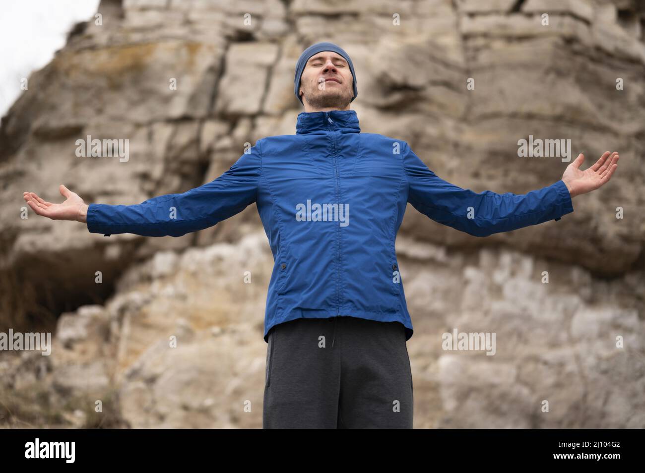 Man standing nature with arms open Stock Photo
