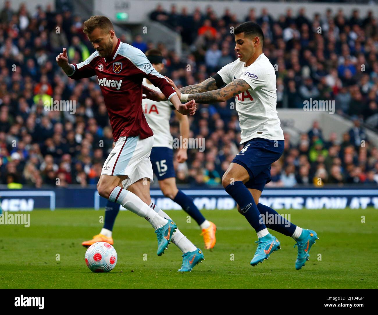 LONDON, England - MARCH 20:L-R West Ham United's Andriy Yarmolenko holds of Tottenham Hotspur's Cristian Romero (on loan from Atalanta)  during Premie Stock Photo