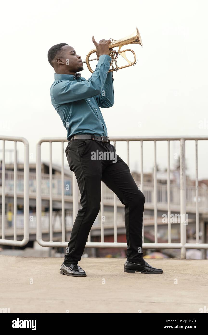 Young man playing music jazz day Stock Photo
