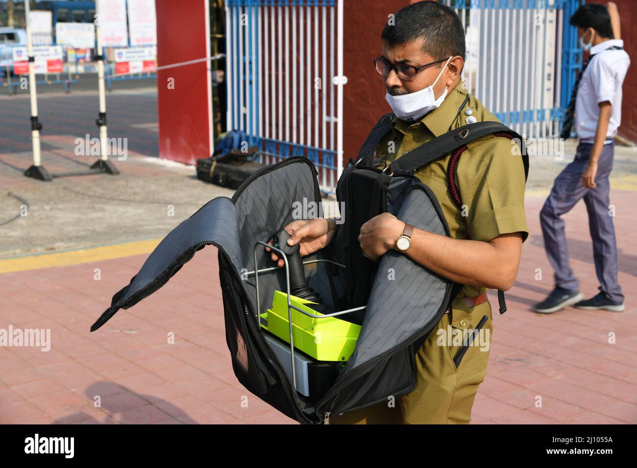 A fire officer operates Swadeshi fire fighting multipurpose robot at the 45th International