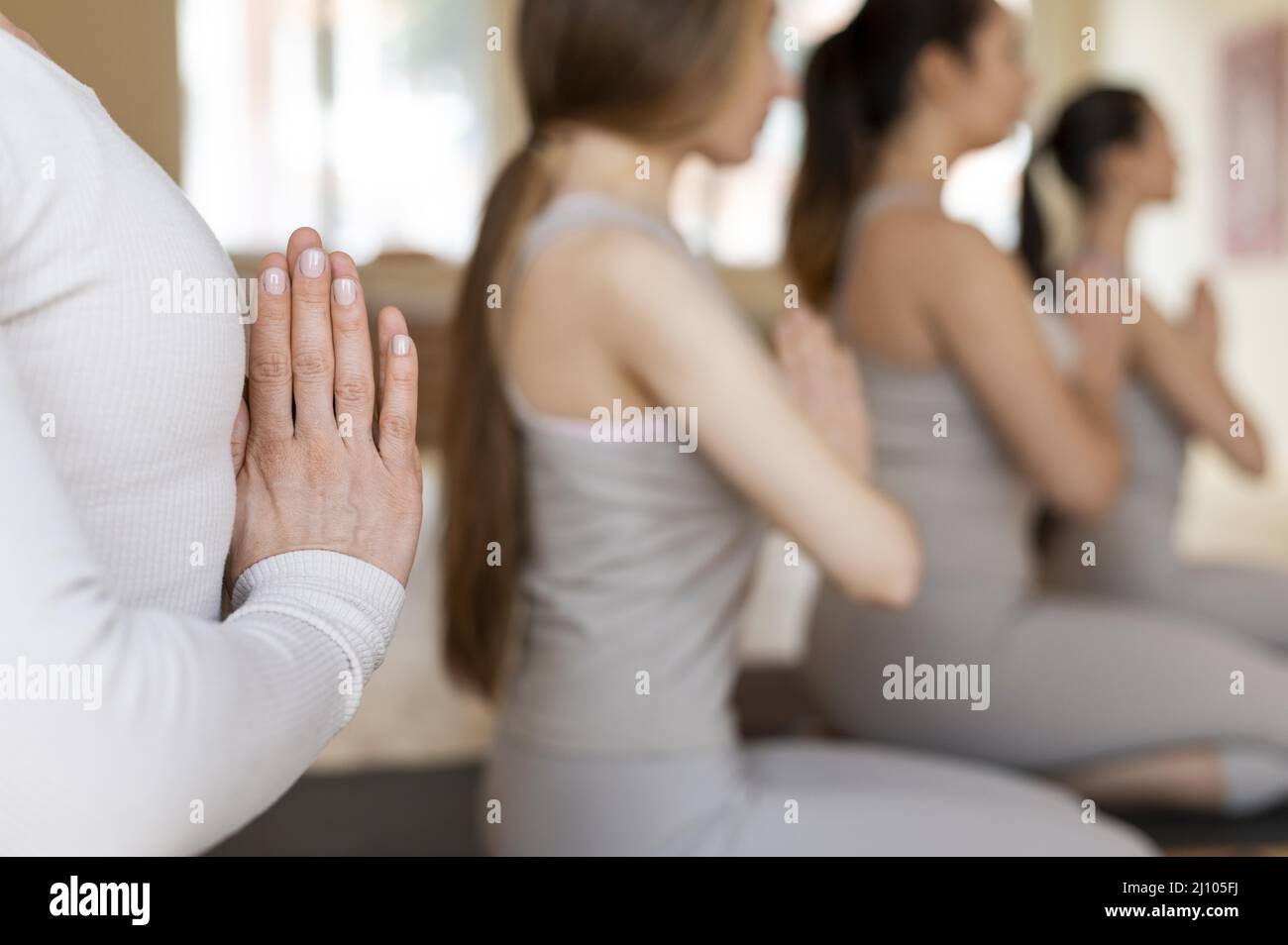 Yoga teacher teaching class 1 Stock Photo