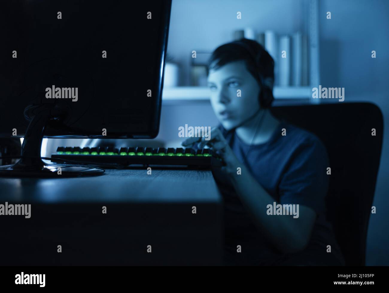 Young boy playing computer Stock Photo