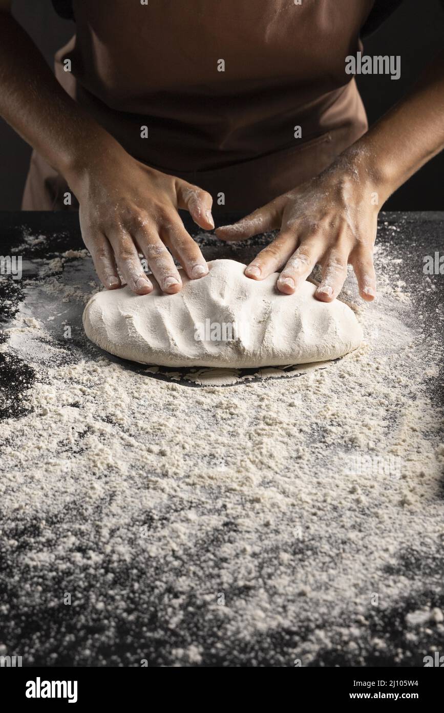 Baker kneading dough counter hires stock photography and images Alamy