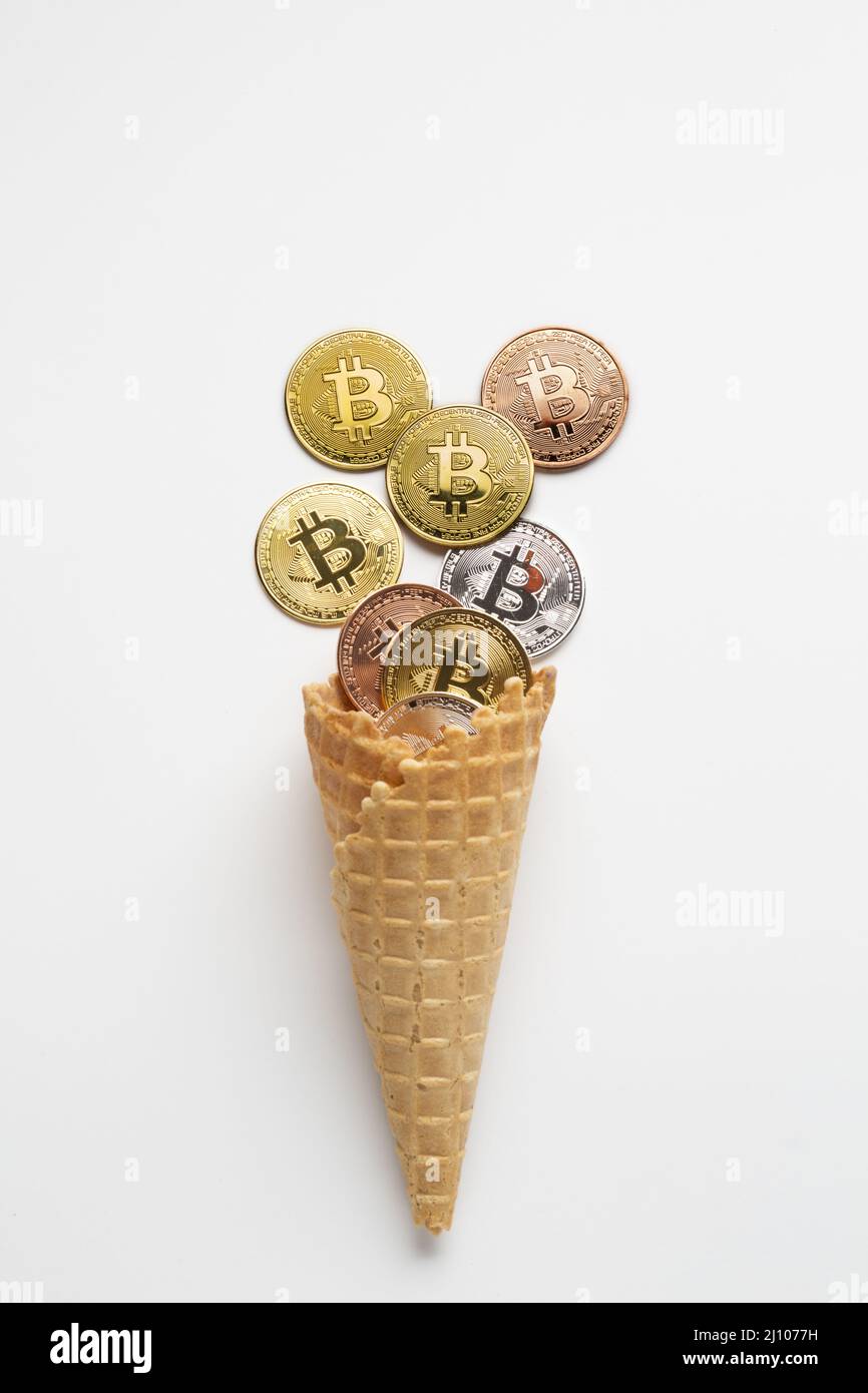 Currency ice cream with bitcoin Stock Photo
