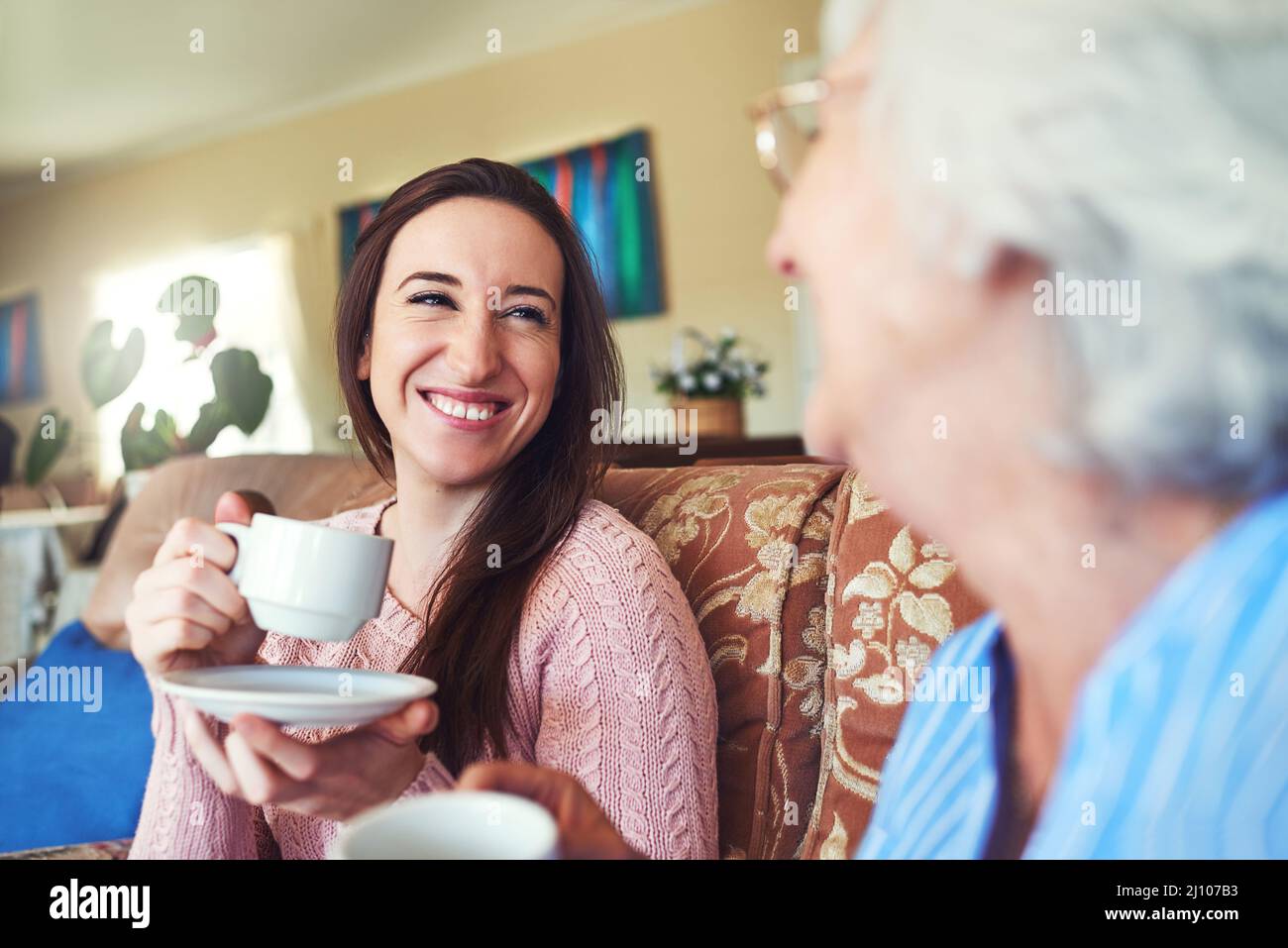 Having tea with Granny is the best. Cropped shot of a senior woman and her granddaughter drinking a cup of tea at home. Stock Photo