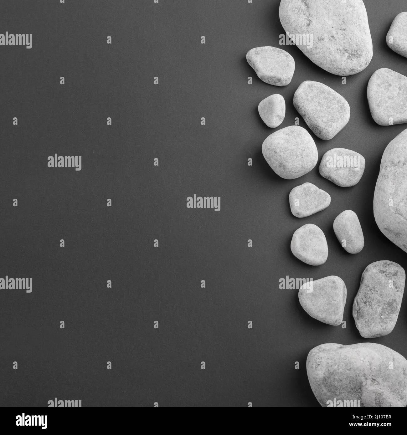 Different type spa gray stones black background Stock Photo