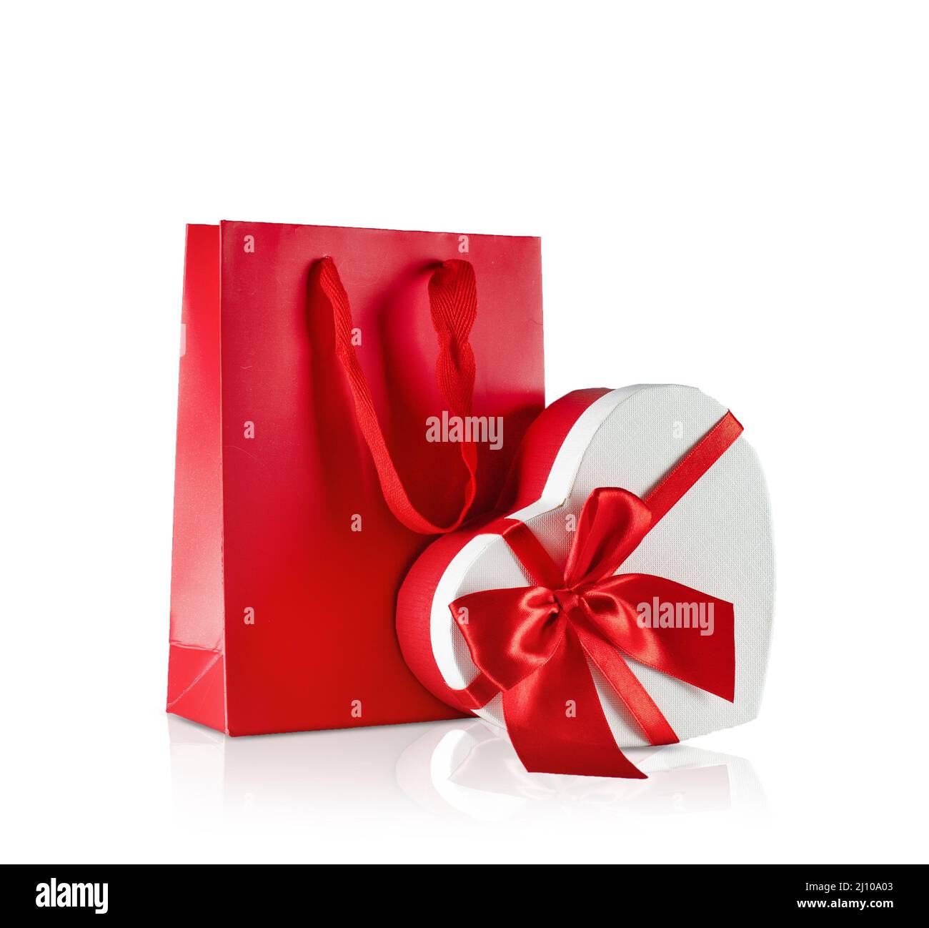 Various sizes of holiday shopping gift bags on isolated white