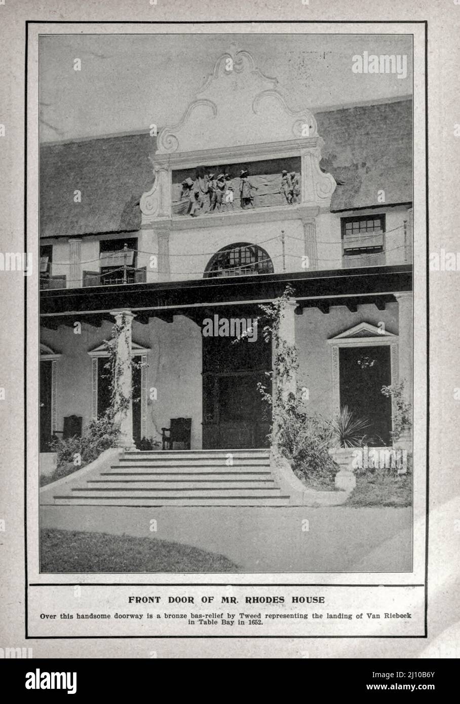 FRONT DOOR OF MR. RHODES HOUSE. Over this handsome doorway is a bronze bas-relief by Tweed representing the landing of Van Riebeek in Table Bay in 1662.Black and white photograph from the book ' South Africa; its history, heroes and wars ' by William Douglas Mackenzie, and Alfred Stead, Publisher Chicago, Philadelphia : Monarch Book Company in 1890 Stock Photo