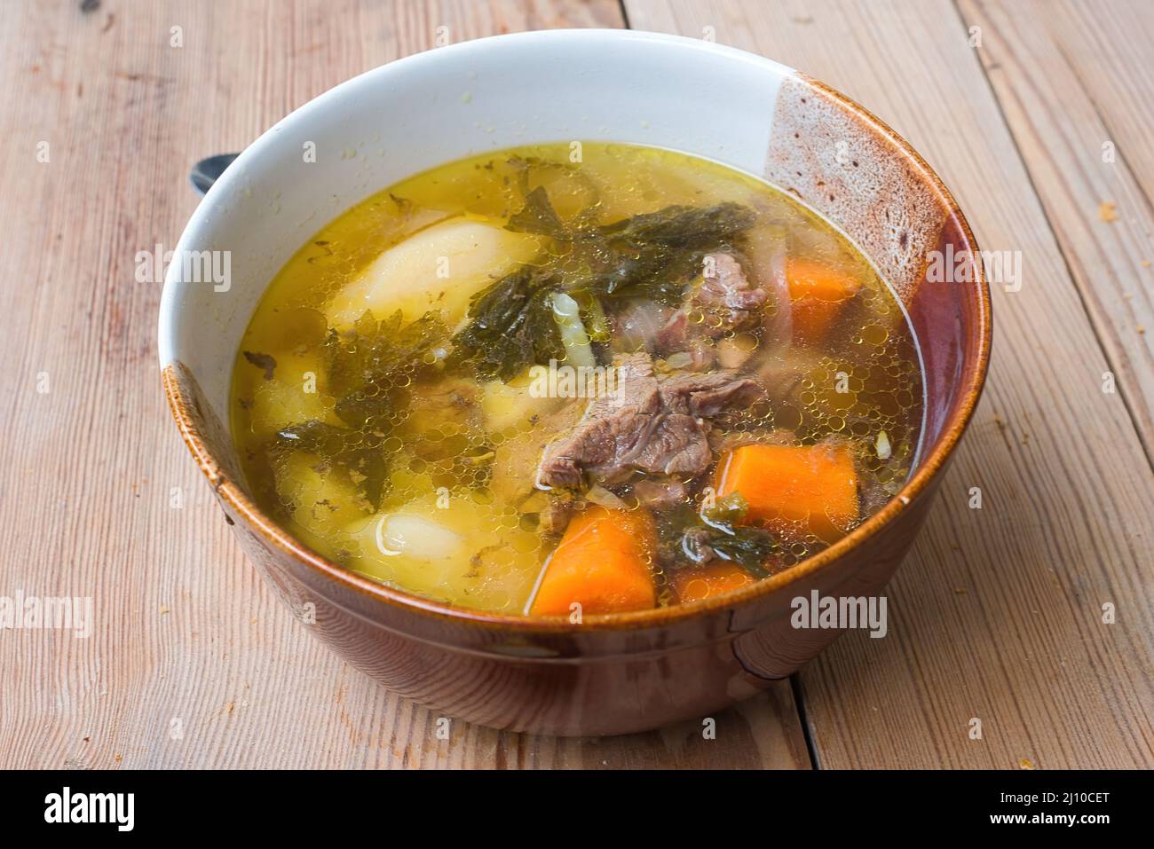 Meat soup, traditional Greek cuisine. Classic soup of the traditional ...