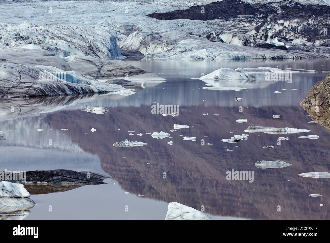 Ice floes and reflections in the lagoon at Hoffellsjokull Glacier, at