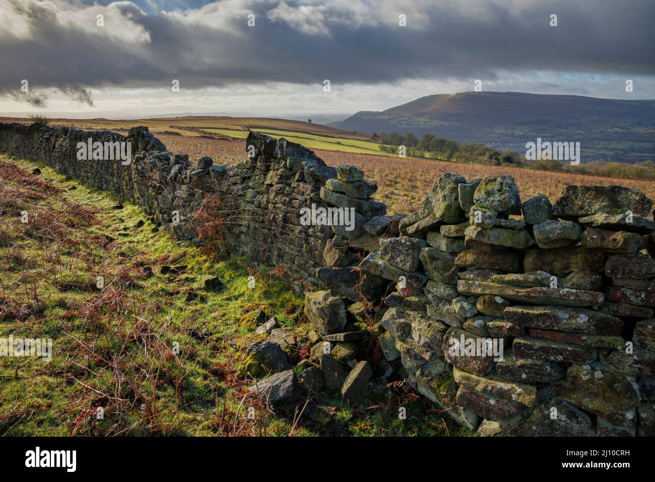 Crumbling stone wall in the South Wales Mountains. Stock Photo